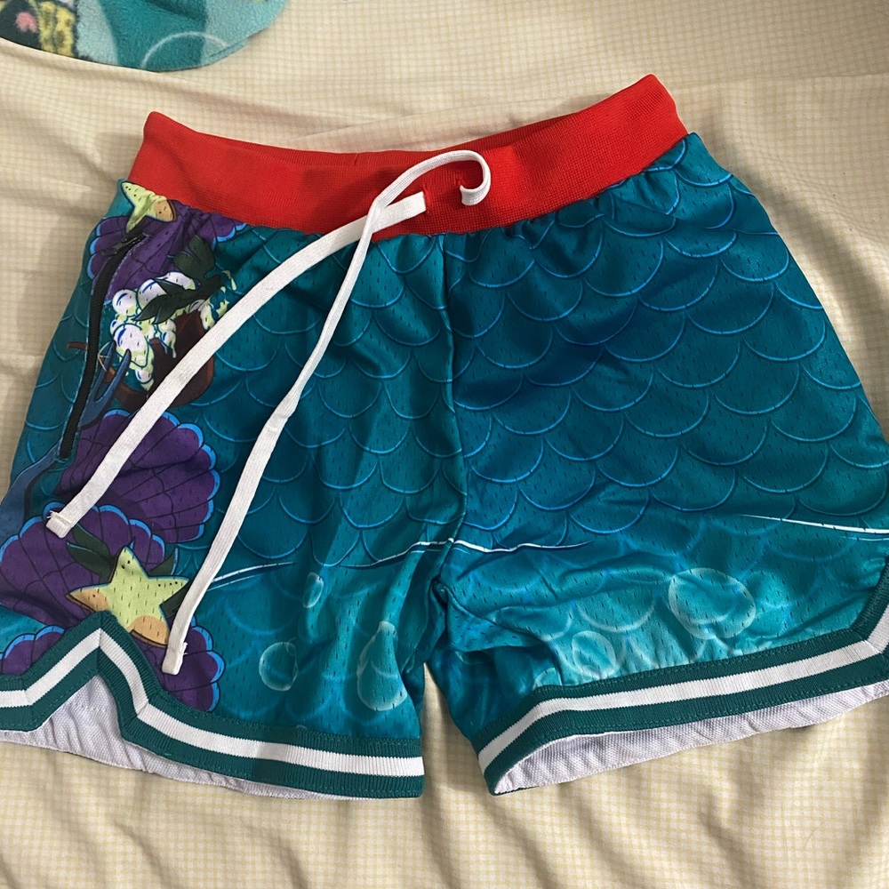 Savs “Little Mermaid” hoop shorts. Size youth L.